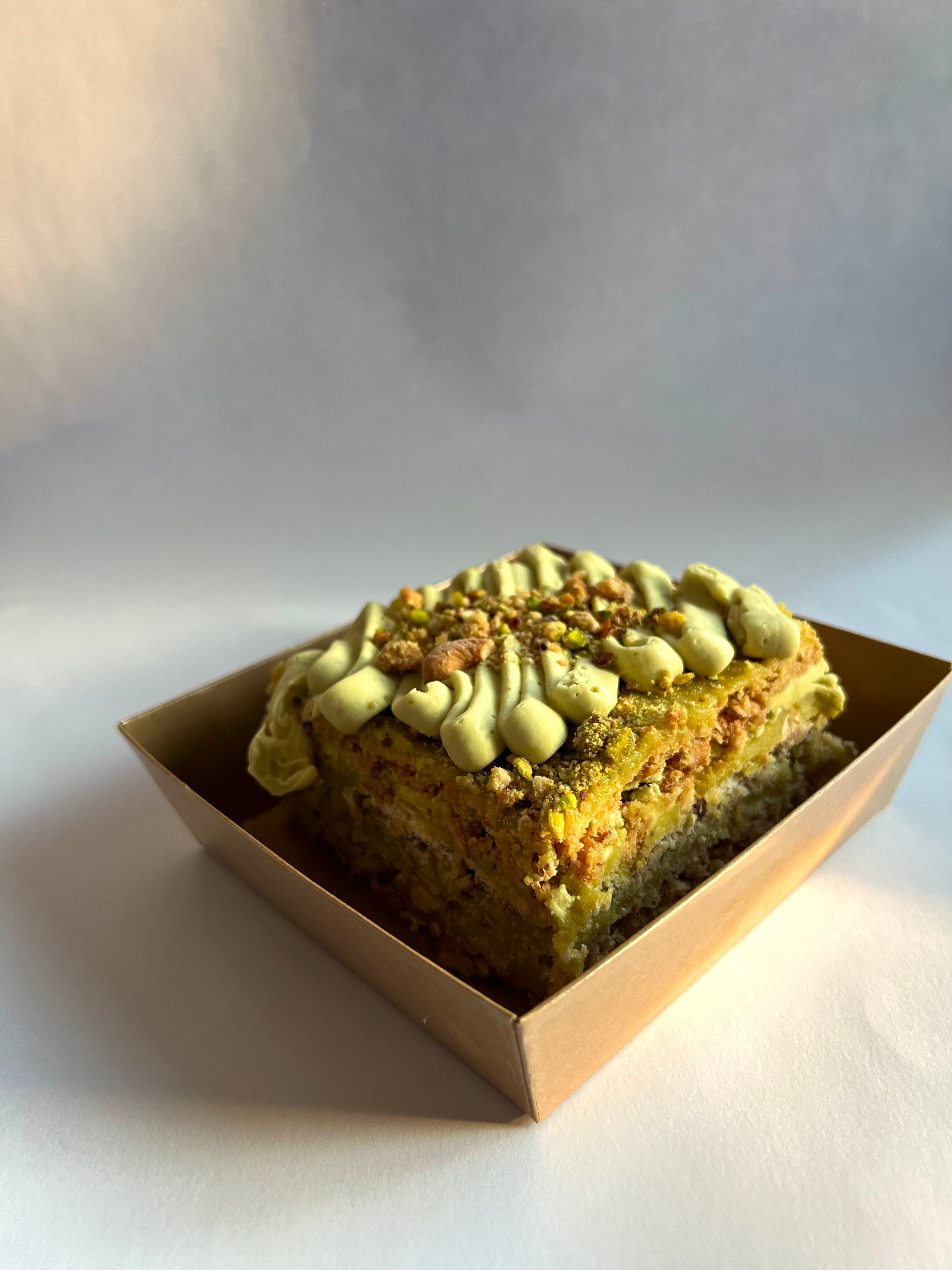 Pistachio Sans Rival Cake Slice
